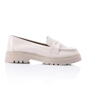 Tassel loafers in shinny beige faux leather